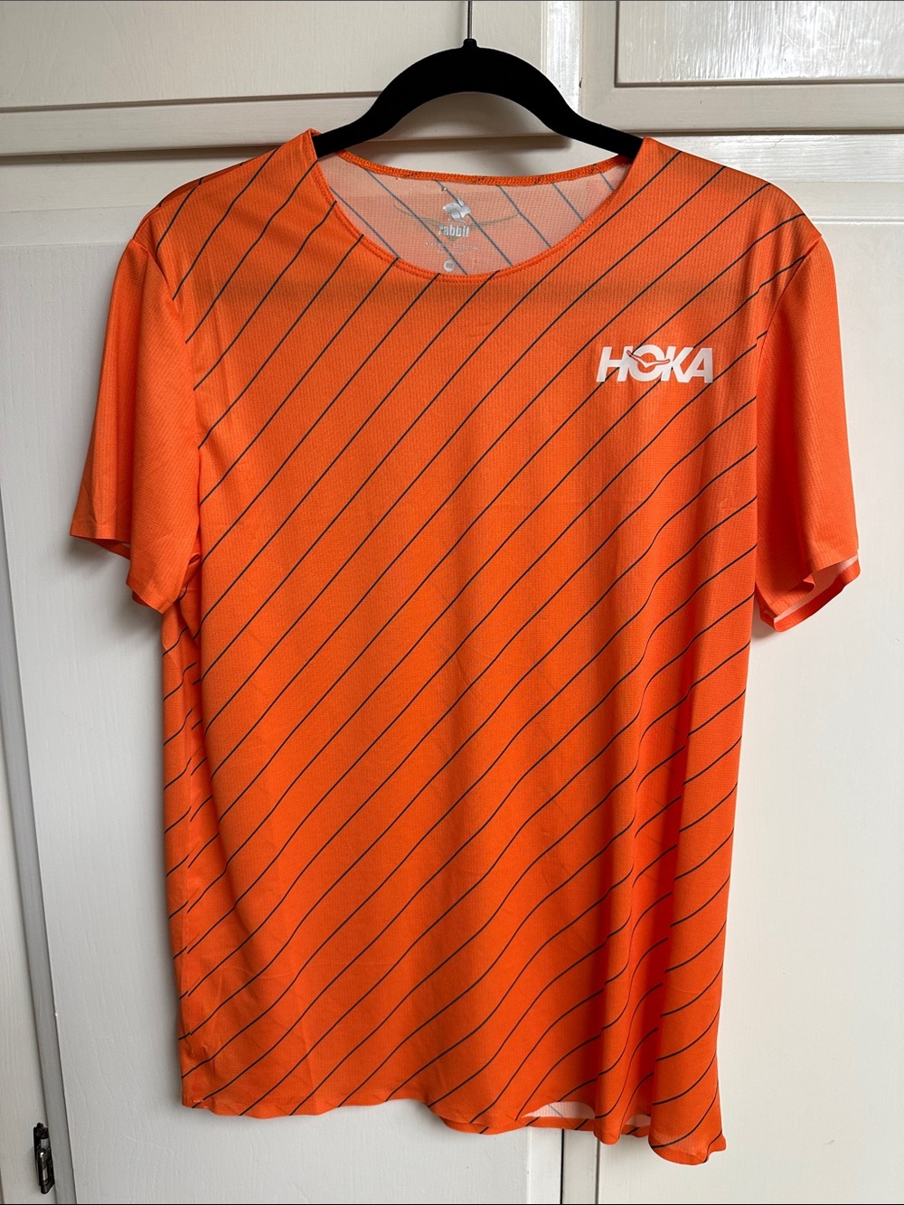 Hoka Men’s Bright Orange Short Sleeve Running Tee with Diagonal Stripe